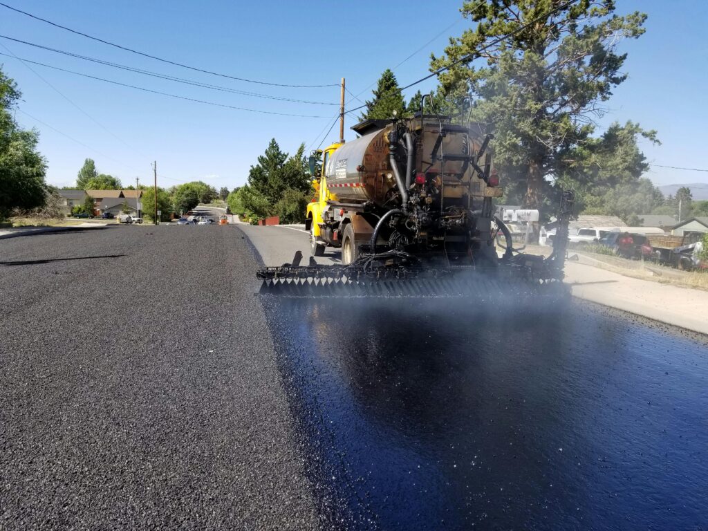 pexels-photo-9843588-9843588 Road construction in Redmond, OR, with asphalt paving equipment. Sunny weather highlights the process.