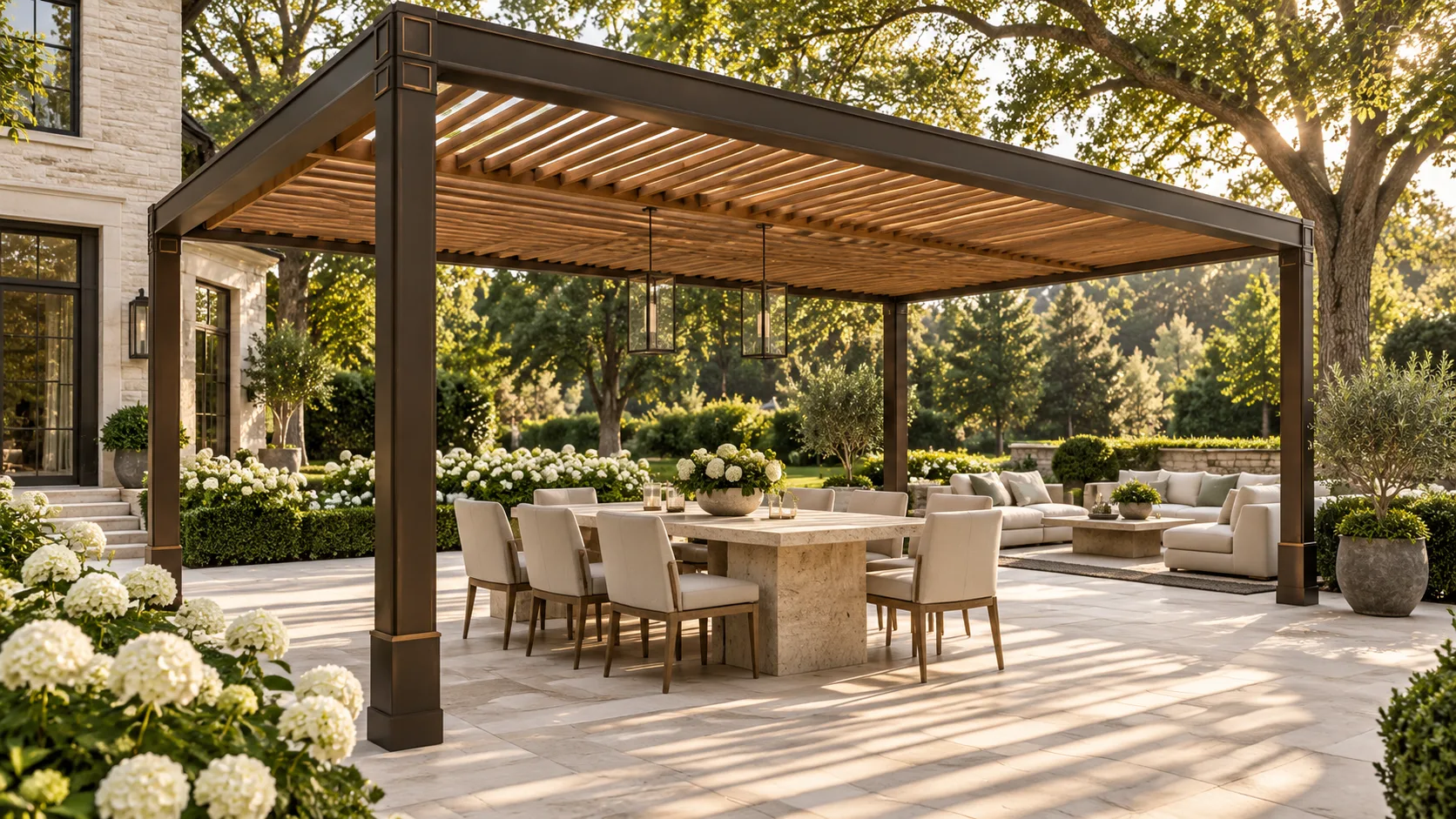 Milton Stone cedar and dark metal pergola design shading a stone dining terrace with hydrangeas