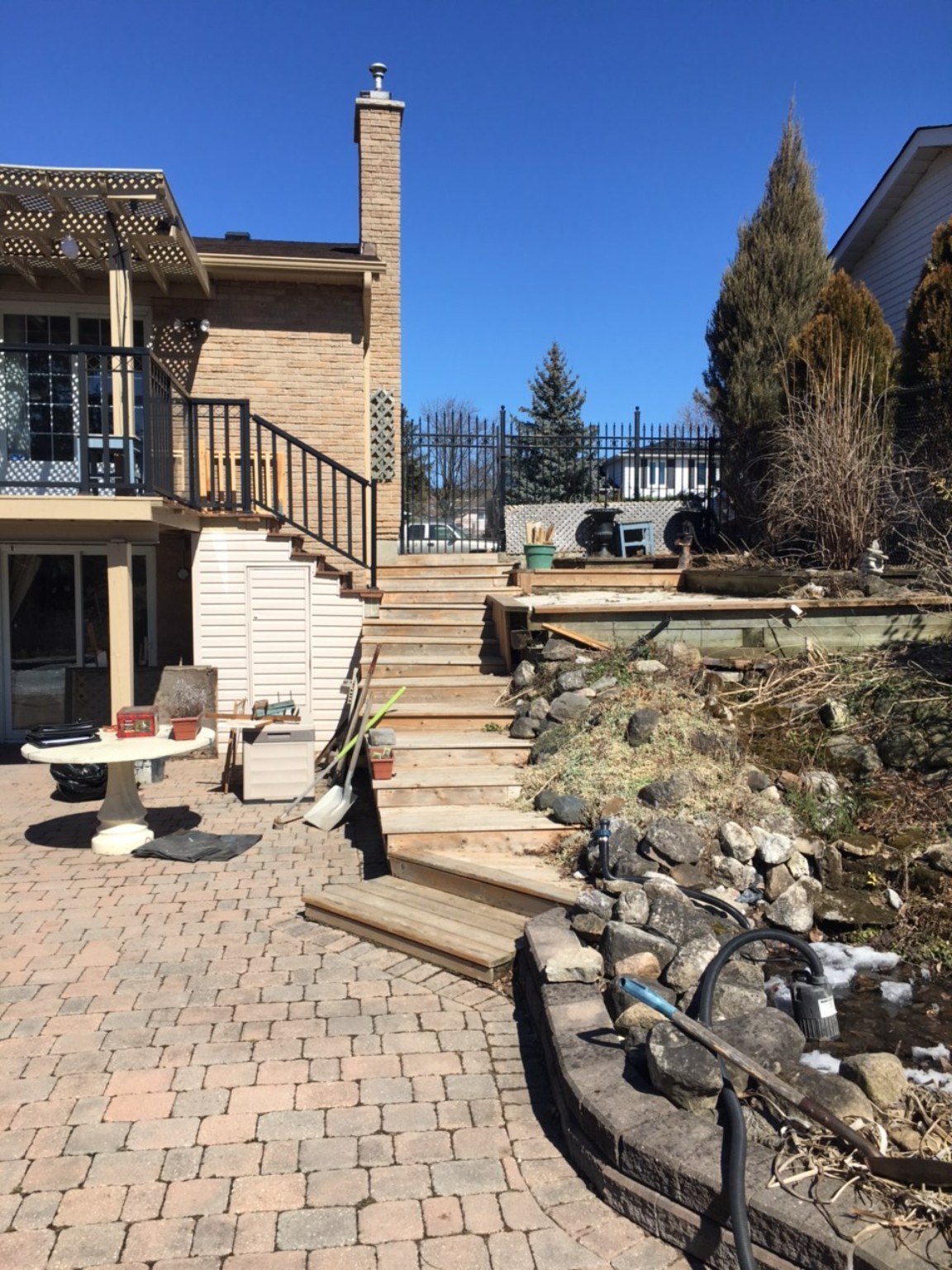 Before renovation poolside slope and timber stairs in Milton