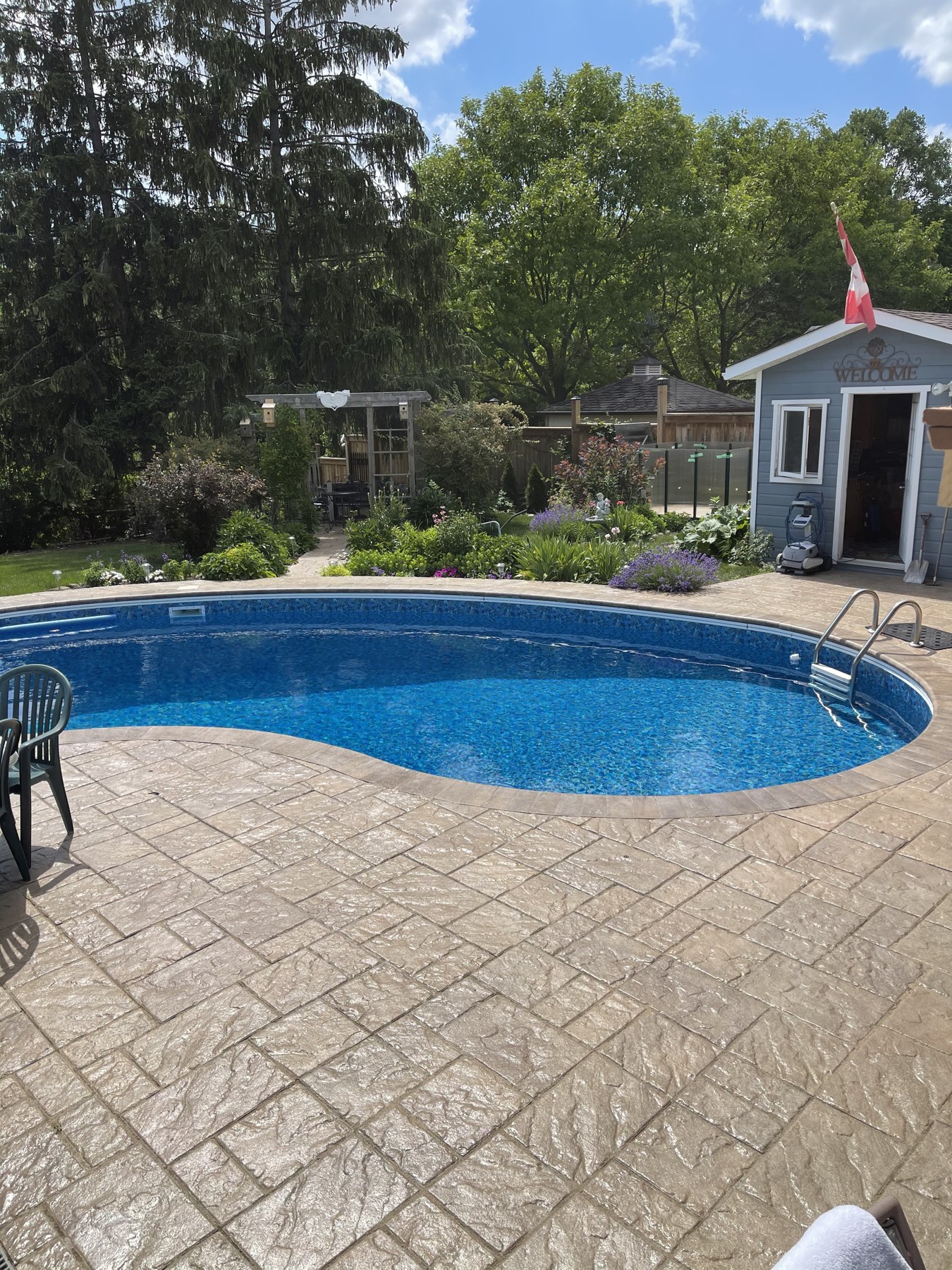 Completed pool deck coping and gardens in Milton