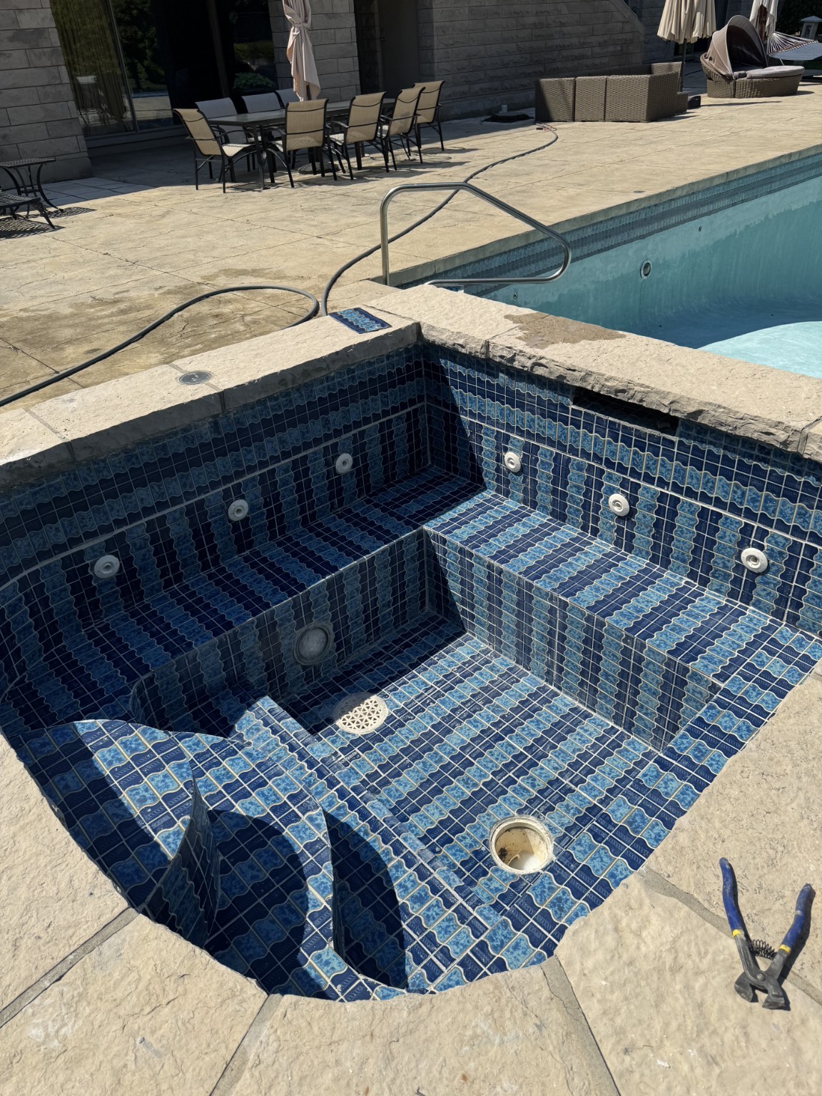 Custom spa interior beside estate pool